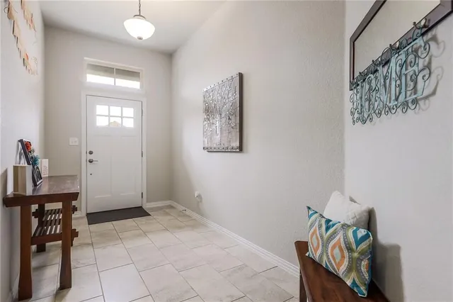a view of a hallway with seating area