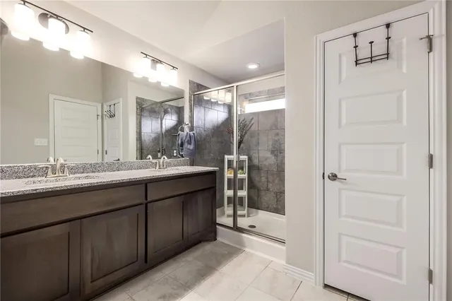 a bedroom with furniture and large window