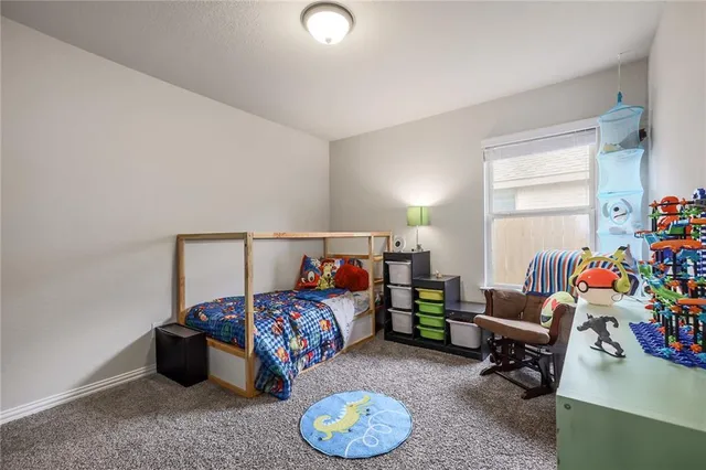 a bedroom with a bed and dresser