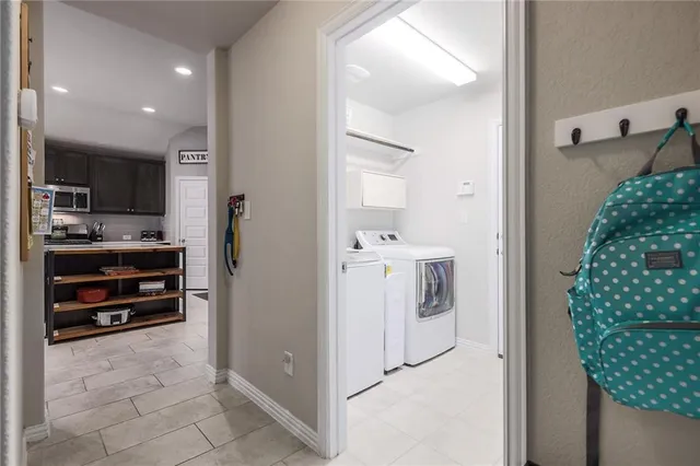 a bathroom with a granite countertop toilet sink and mirror