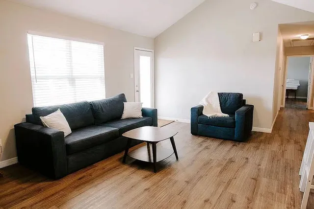 a kitchen with sink refrigerator and cabinets