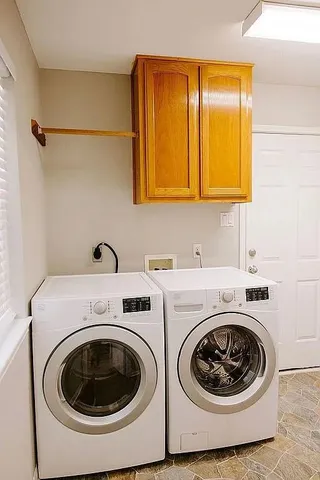 a utility room with dryer and washer