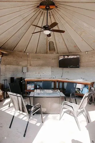 a view of a chairs and table in the terrace