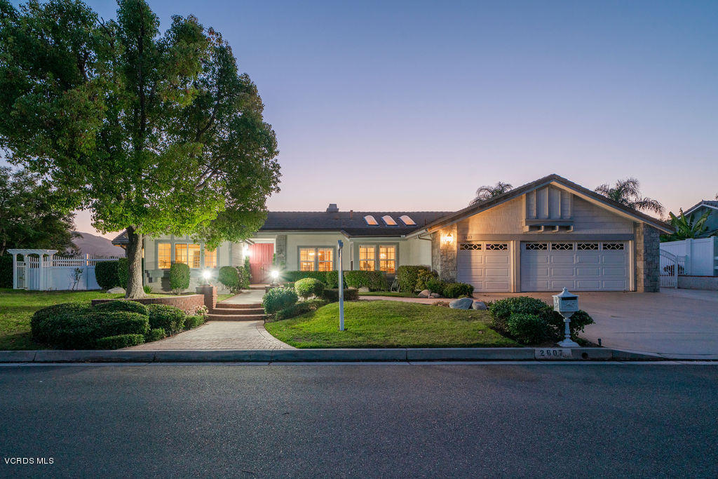 2607 Riata Court Camarillo, CA 93012 - Photo 1 of 54 a front view of a house with a yard and garage