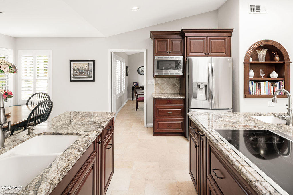 2607 Riata Court Camarillo, CA 93012 - Photo 12 of 54 a kitchen with granite countertop a sink a counter top space and cabinets
