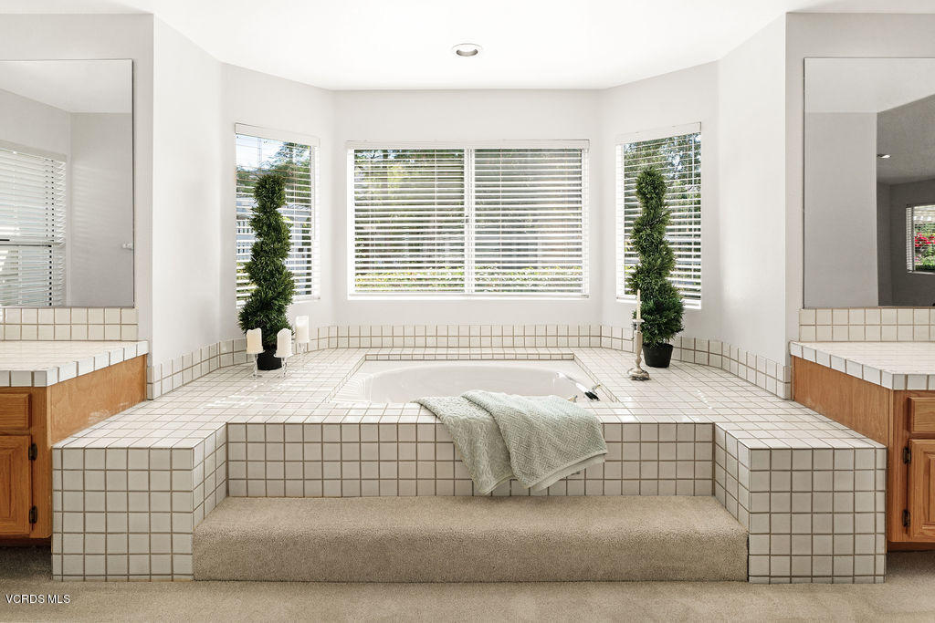 2607 Riata Court Camarillo, CA 93012 - Photo 21 of 54 a bedroom with a bed and glass window