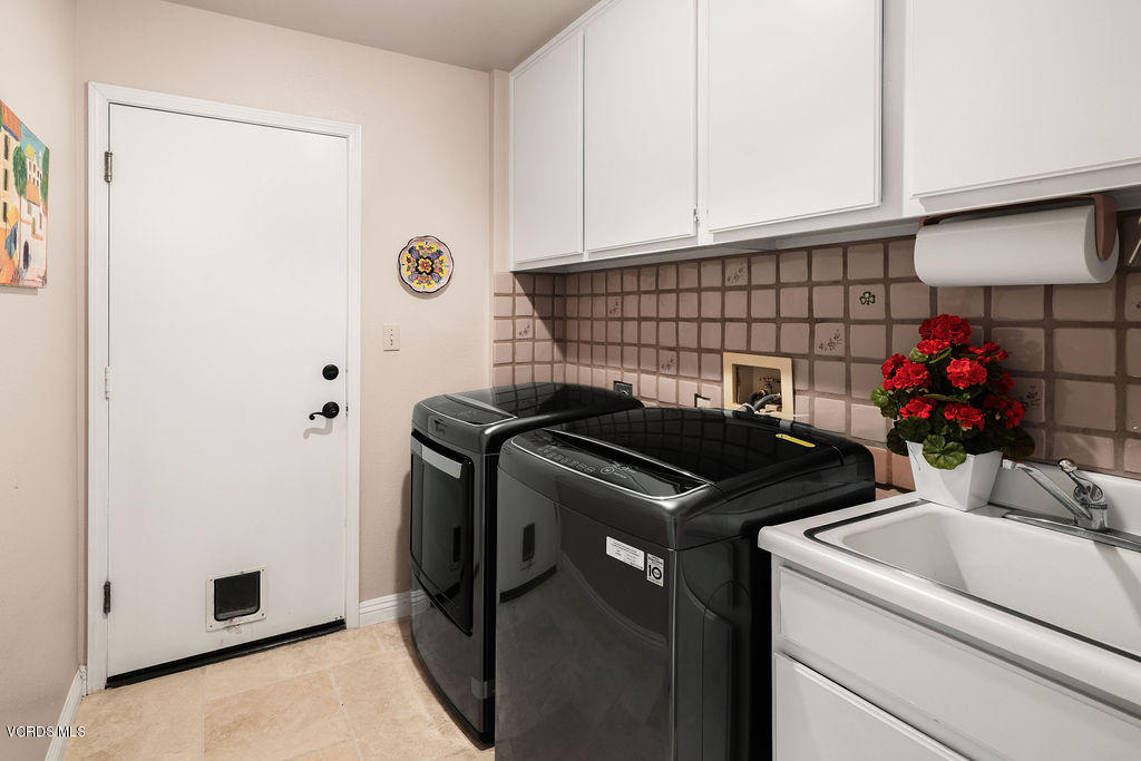 2607 Riata Court Camarillo, CA 93012 - Photo 25 of 54 a kitchen with stainless steel appliances granite countertop a sink stove and refrigerator