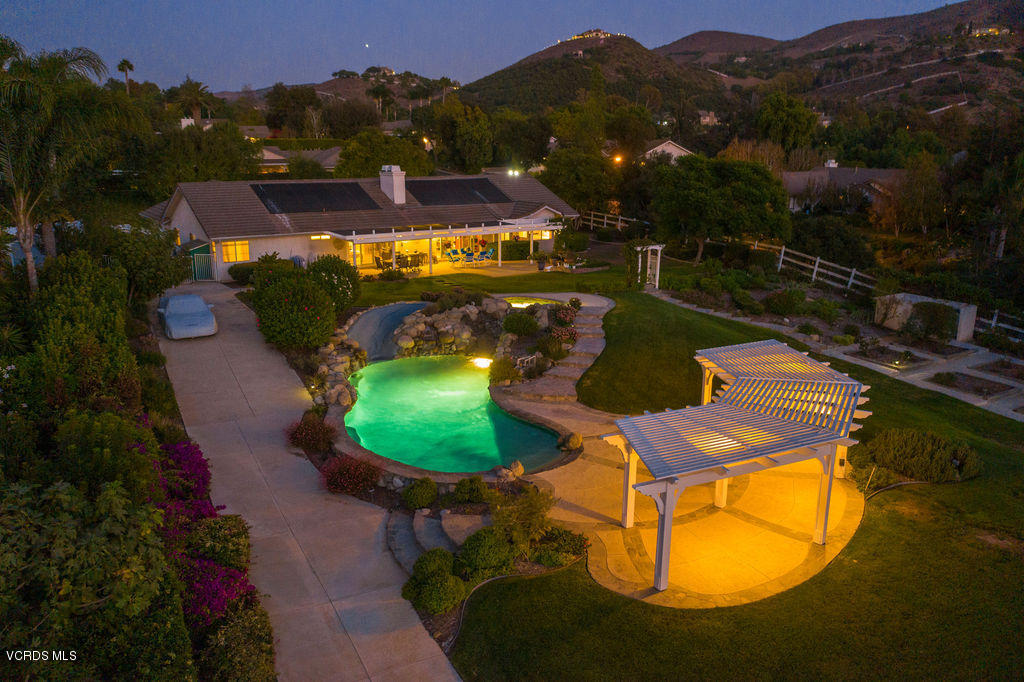 2607 Riata Court Camarillo, CA 93012 - Photo 6 of 54 an aerial view of a house with a swimming pool yard and mountain view