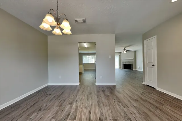 a view of livingroom with kitchen island wooden floor and window