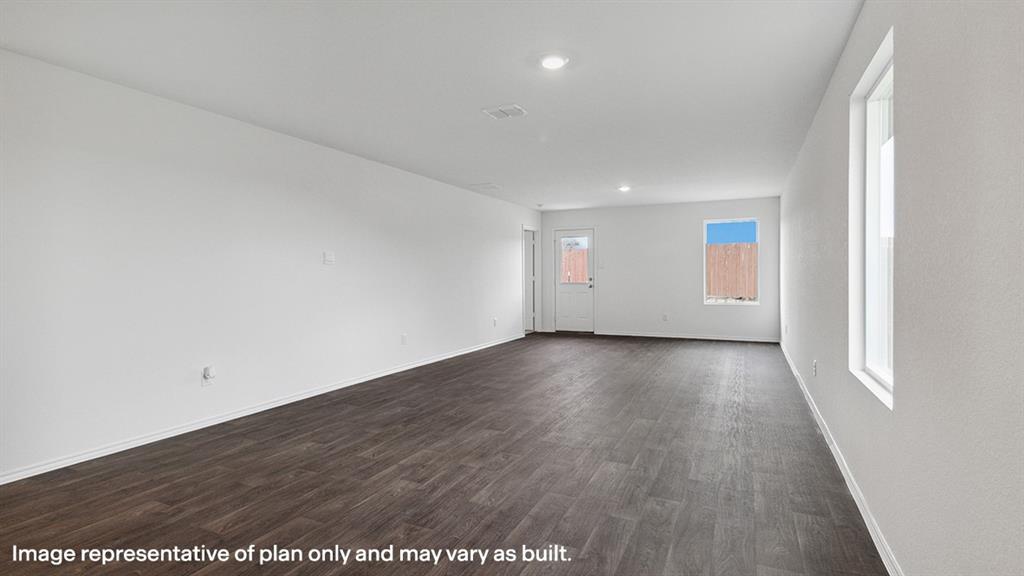3522 Spring Time Street Forney, TX 75126 - Photo 13 of 27 Spacious room featuring wood-finish flooring, white walls, and recessed lighting