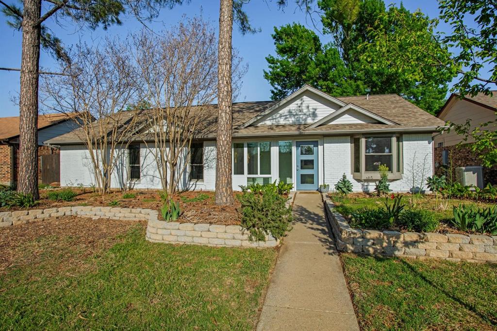 1905 Jasmine Street Denton, TX 76205 - Photo 1 of 1 a front view of a house with garden