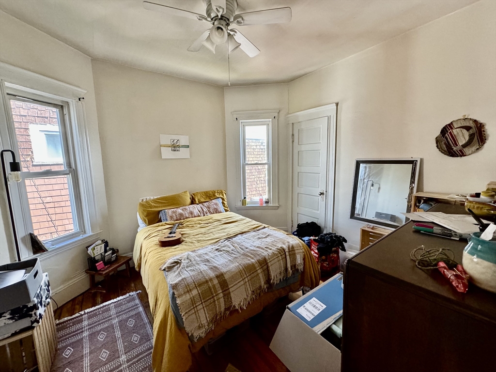 11 Wainwright Street, Unit 3 Boston, MA 02124 - Photo 13 of 26 a bedroom with a bed and window