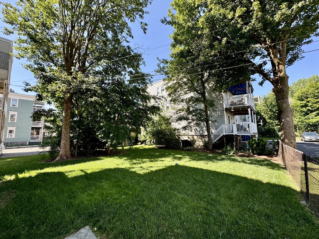 11 Wainwright Street, Unit 3 Boston, MA 02124 - Photo 18 of 26 a view of a backyard with a garden