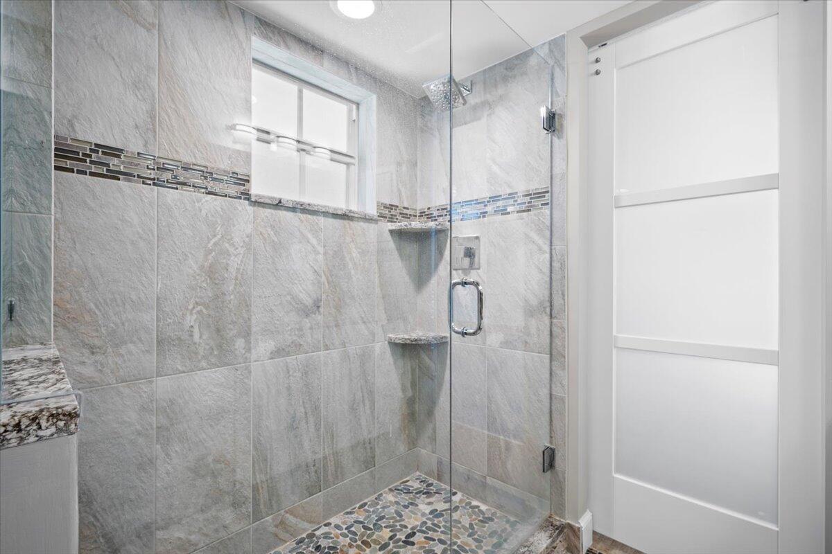 1252 Sugar Sands Boulevard, Unit 132 Riviera Beach, FL 33404 - Photo 17 of 40 a bathroom with a shower