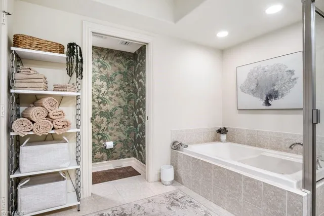 a bathroom with a bathtub and a shower