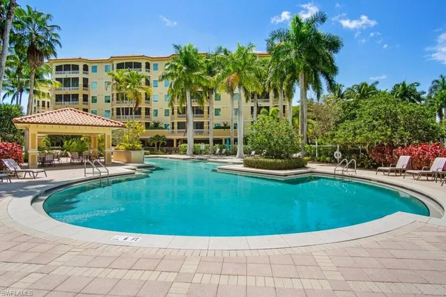 a view of a swimming pool with a patio