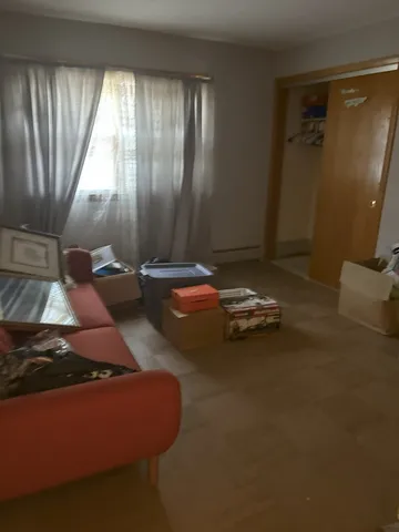 a bedroom with bed and window