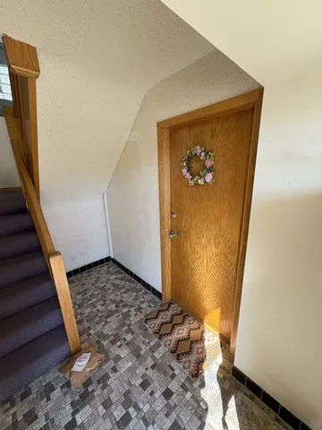 a view of a hallway with wooden floor and a hallway