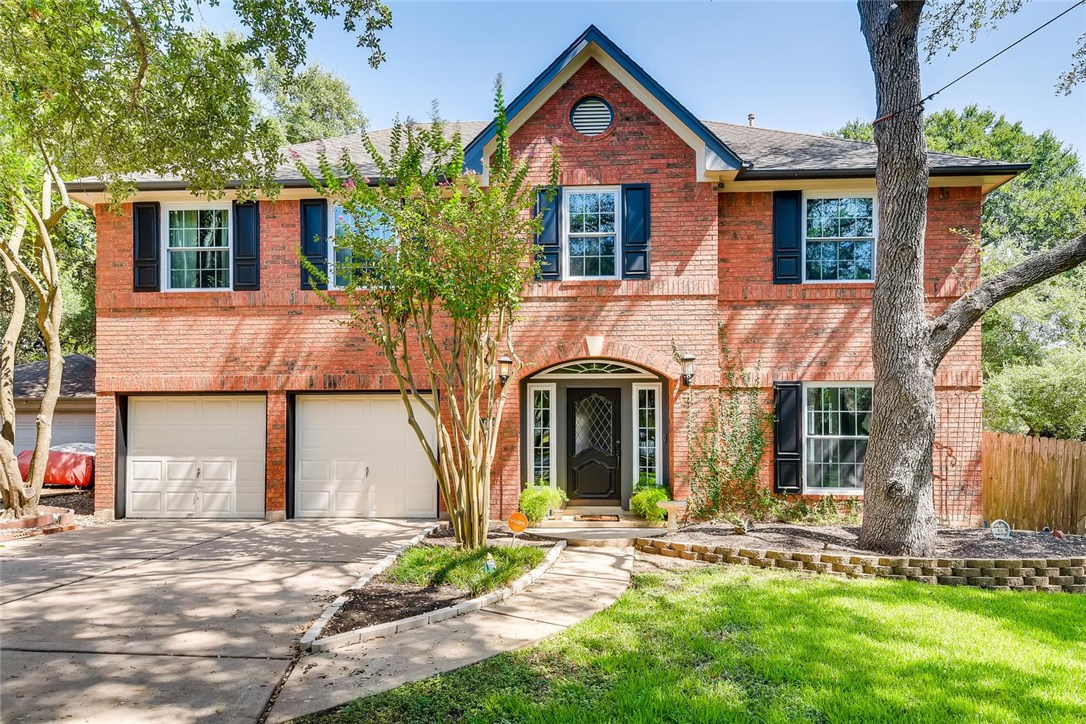 11006 Needham Court Austin, TX 78739 - Photo 1 of 1 front view of a house with a yard