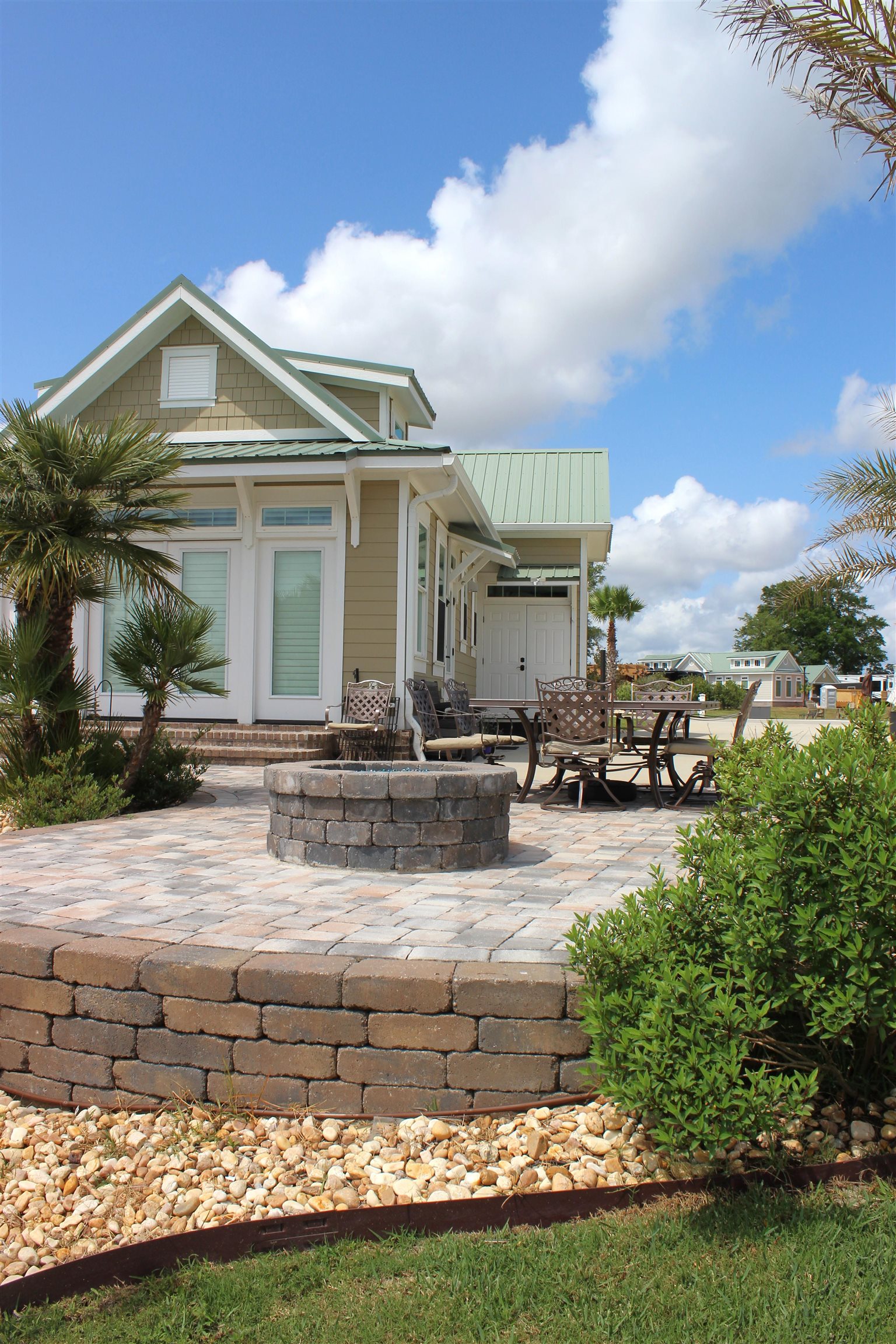 28116 Migratory Way, Unit LOT 105 Elberta, AL 36530 - Photo 7 of 75 Outside deck with fire pit
