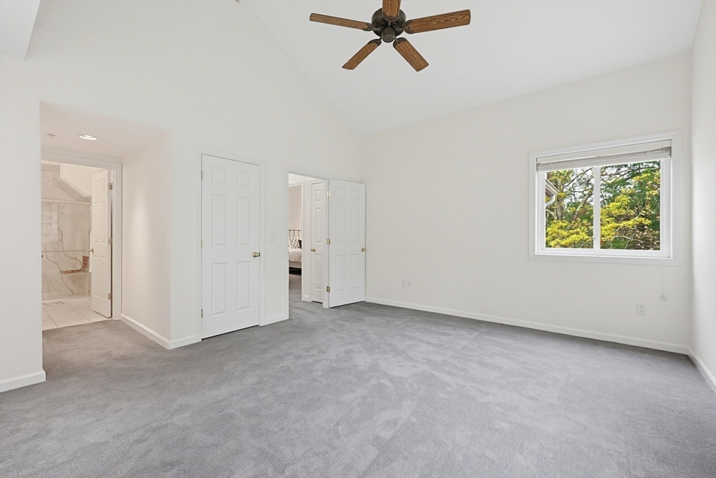 3002 Maple Brook Road, Unit 3002 Bellingham, MA 02019 - Photo 28 of 42 a view of a room with a ceiling fan and window
