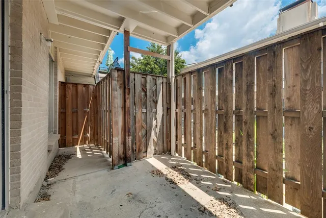 a view of outdoor space with wooden fence