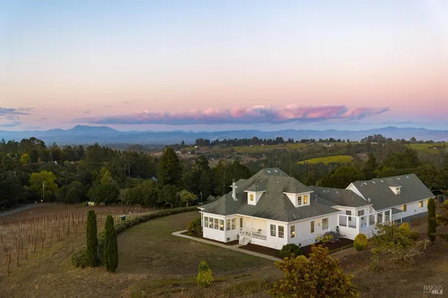 an aerial view of a house with a garden