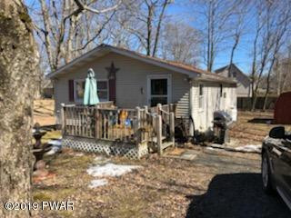 148 Roundhill Road Dingmans Ferry, PA 18328 - Photo 9 of 24 a view of a house with a yard