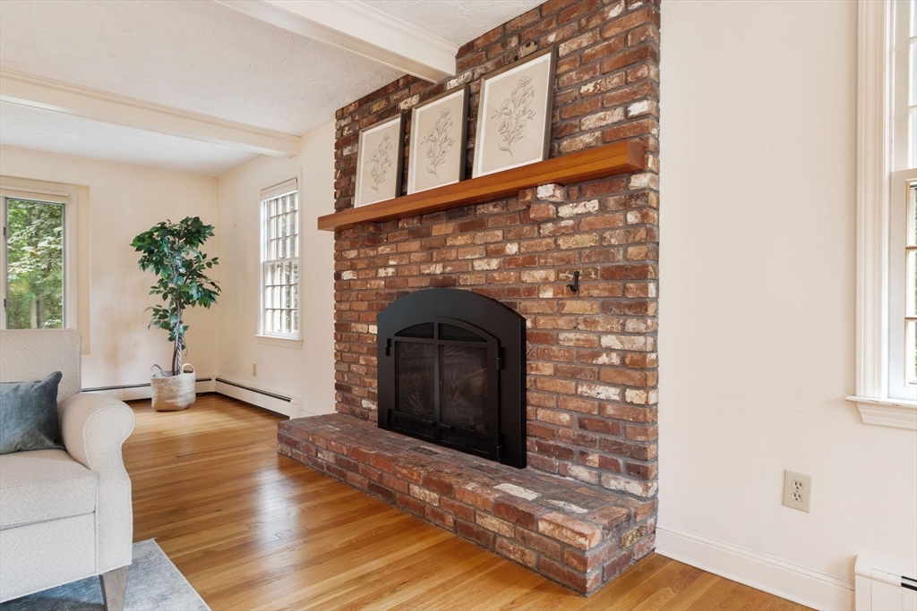 244 Hunters Ridge Road Concord, MA 01742 - Photo 16 of 41 a living room with a fireplace