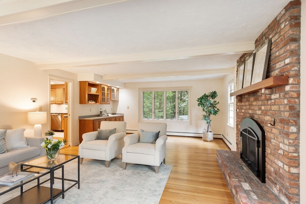 244 Hunters Ridge Road Concord, MA 01742 - Photo 17 of 41 a living room with furniture and a fireplace