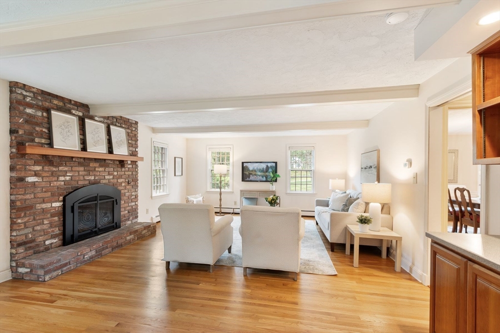 244 Hunters Ridge Road Concord, MA 01742 - Photo 18 of 41 a living room with furniture and a fireplace