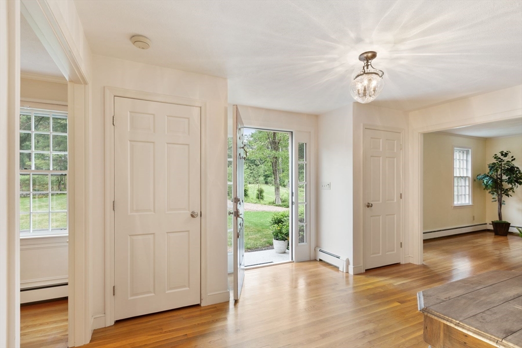 244 Hunters Ridge Road Concord, MA 01742 - Photo 21 of 41 an empty room with wooden floor cabinet and windows