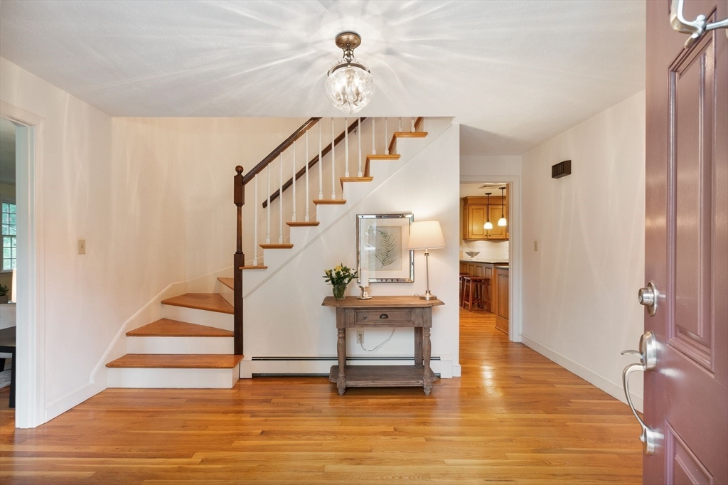244 Hunters Ridge Road Concord, MA 01742 - Photo 22 of 41 a view of entryway and hall with wooden floor