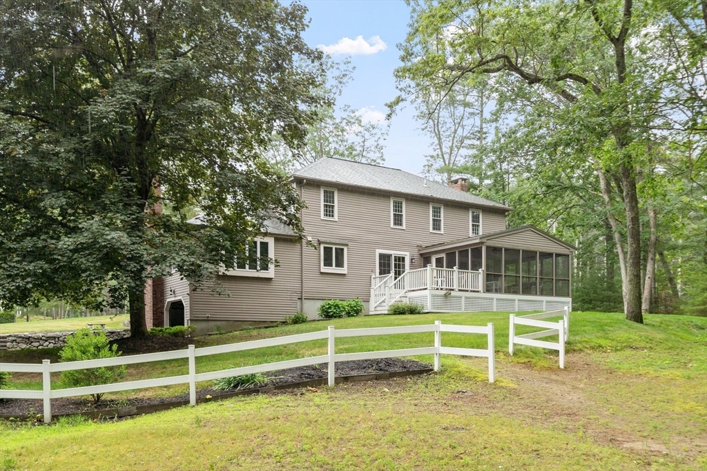 244 Hunters Ridge Road Concord, MA 01742 - Photo 3 of 41 a house view with a sitting space and garden view