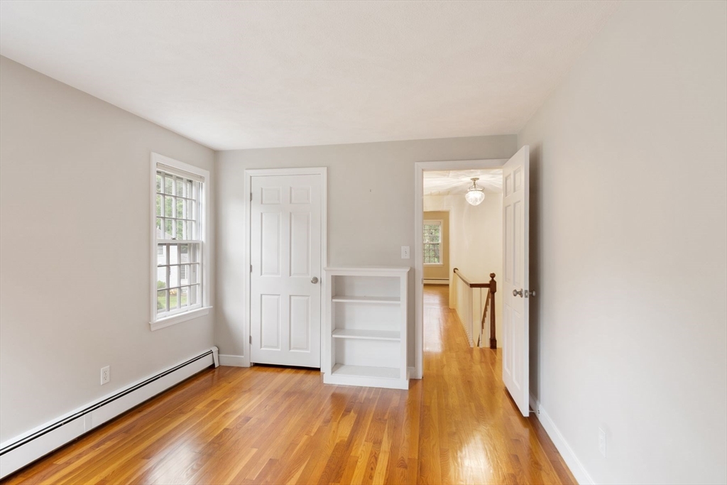 244 Hunters Ridge Road Concord, MA 01742 - Photo 32 of 41 a view of hallway with wooden floor