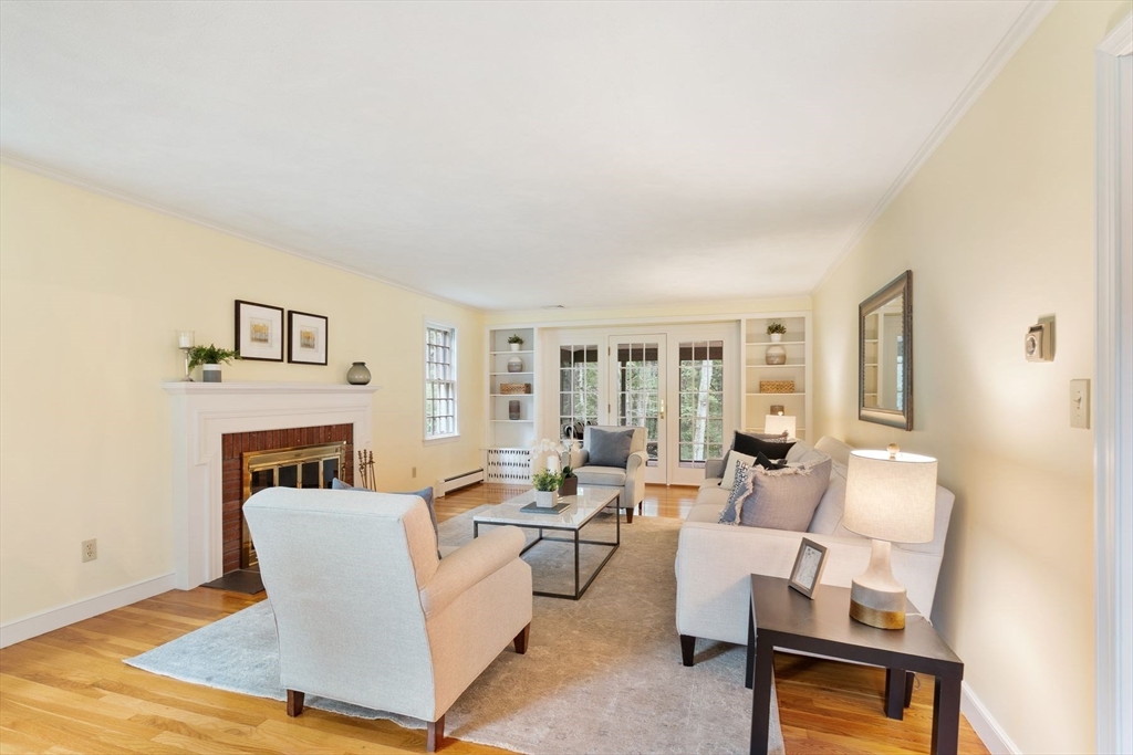 244 Hunters Ridge Road Concord, MA 01742 - Photo 8 of 41 a living room with furniture and a fireplace
