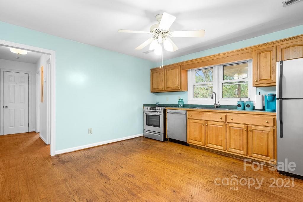 14 Browning Road Waynesville, NC 28786 - Photo 12 of 26 a kitchen with stainless steel appliances granite countertop a stove a sink and a refrigerator