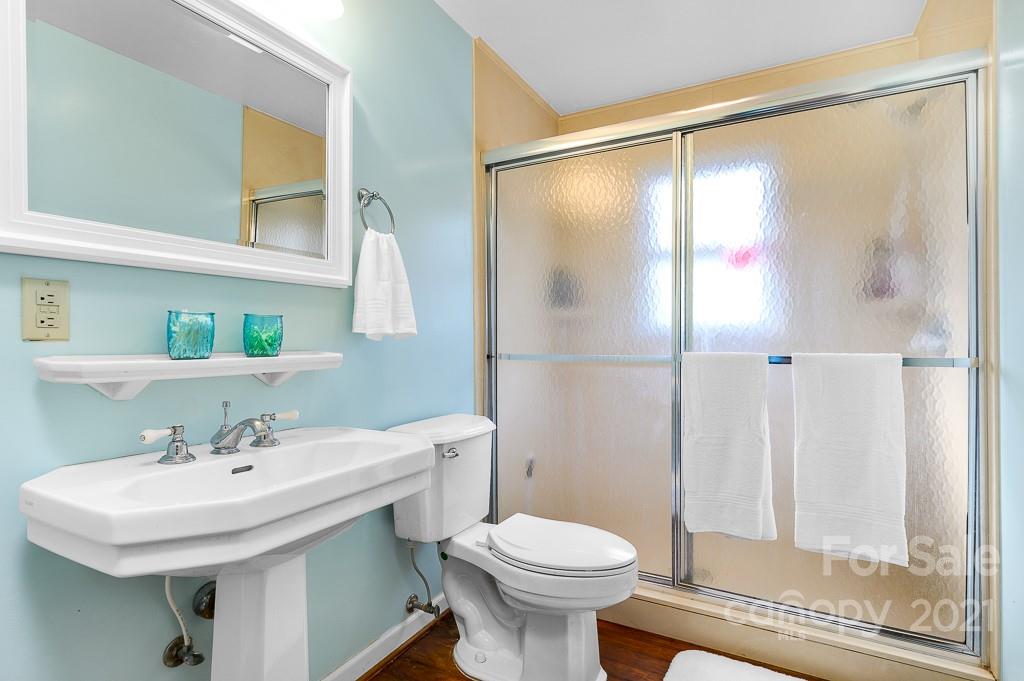 14 Browning Road Waynesville, NC 28786 - Photo 14 of 26 a bathroom with a sink toilet and shower