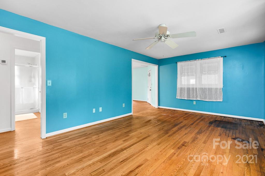14 Browning Road Waynesville, NC 28786 - Photo 8 of 26 a view of an empty room with wooden floor and a window