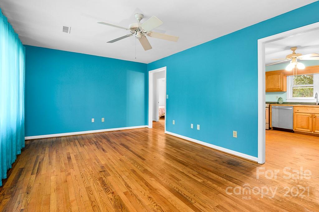 14 Browning Road Waynesville, NC 28786 - Photo 9 of 26 a view of an empty room with window and wooden floor