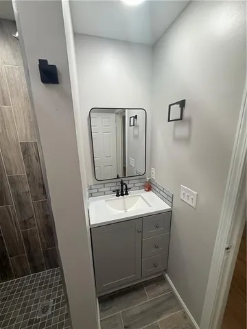 a bathroom with a sink and a mirror