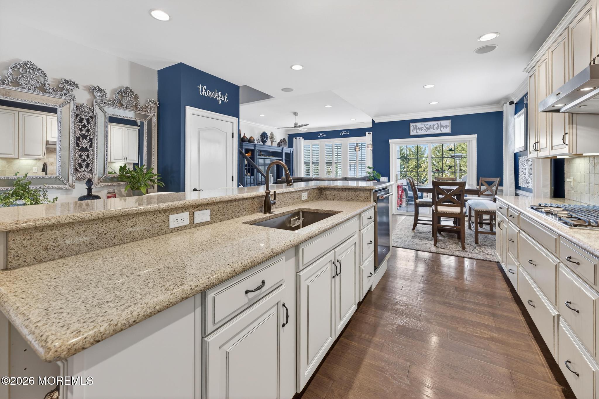 35 Addlestone Lane Manchester Township, NJ 08759 - Photo 12 of 44 a large kitchen with kitchen island granite countertop a large center island and a sink