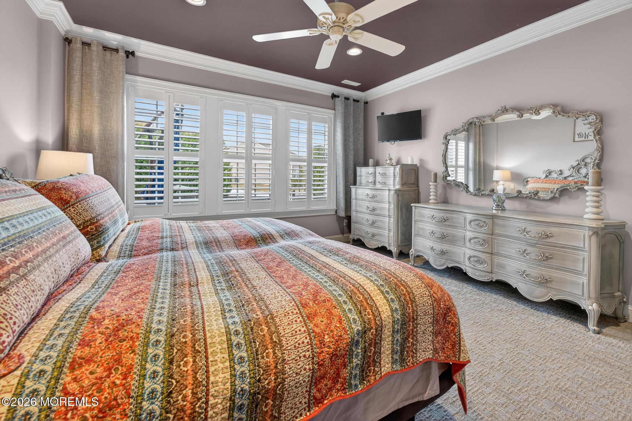 35 Addlestone Lane Manchester Township, NJ 08759 - Photo 20 of 44 a bedroom with a large bed and a chandelier