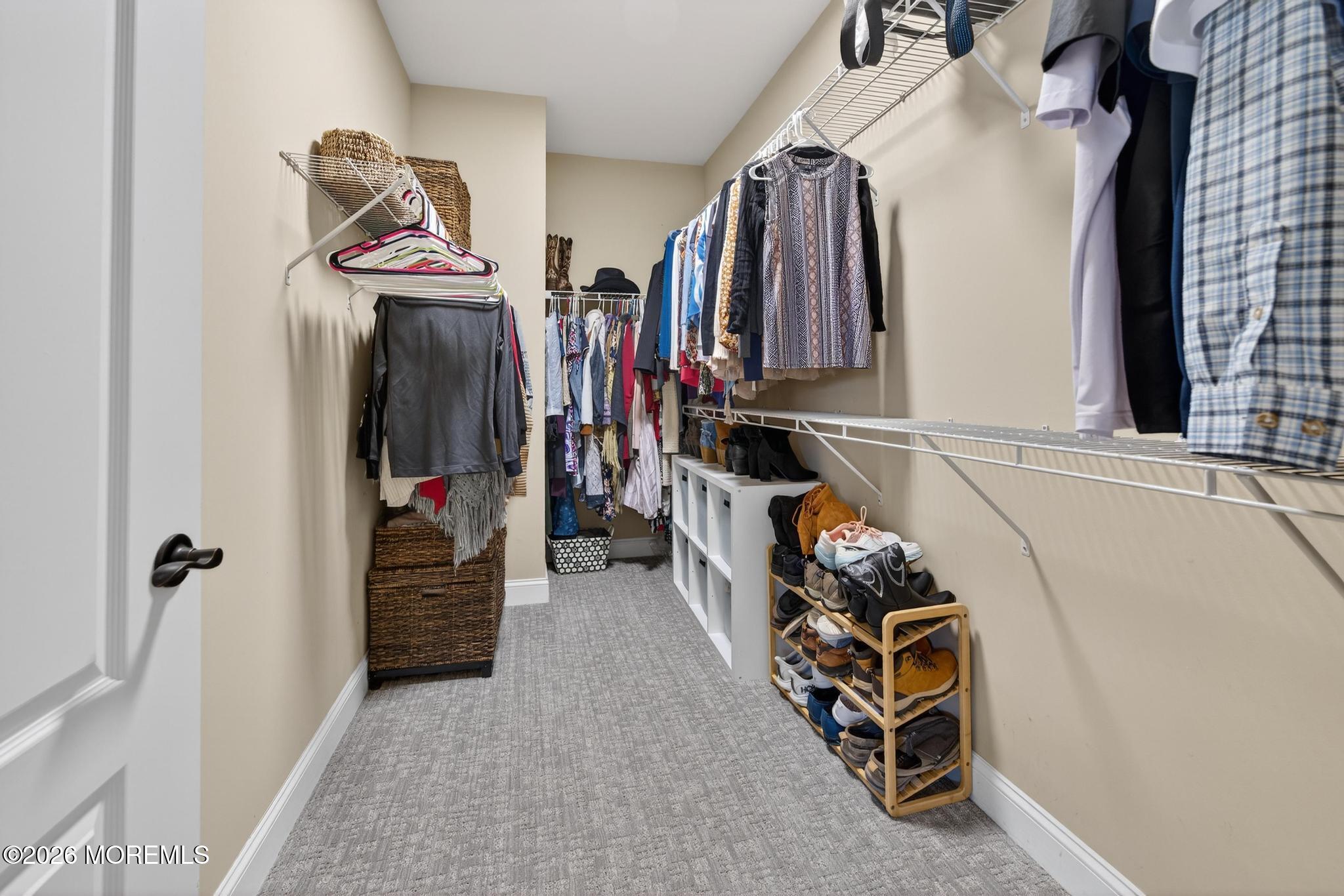 35 Addlestone Lane Manchester Township, NJ 08759 - Photo 24 of 44 a view of walk in closet with clothes and shoes