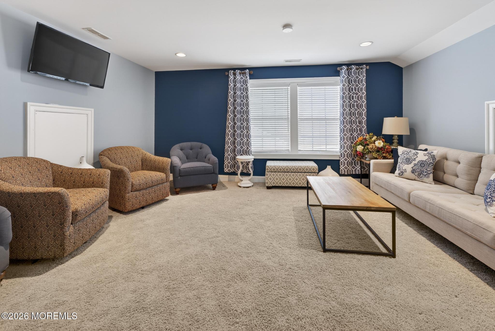 35 Addlestone Lane Manchester Township, NJ 08759 - Photo 31 of 44 a living room with furniture and a flat screen tv