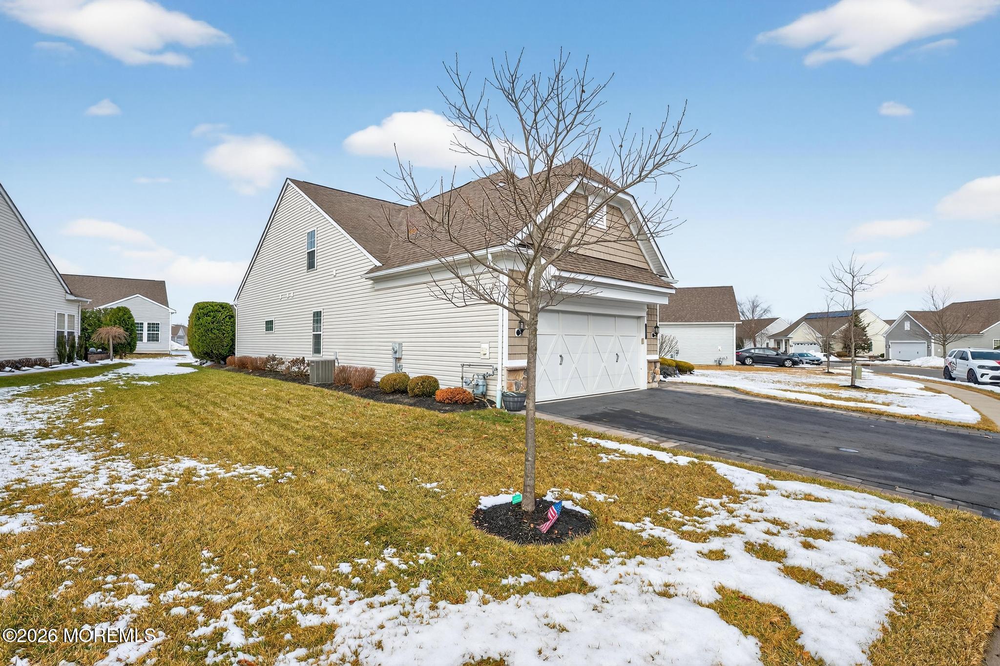 35 Addlestone Lane Manchester Township, NJ 08759 - Photo 5 of 44 a view of a house with snow on the road