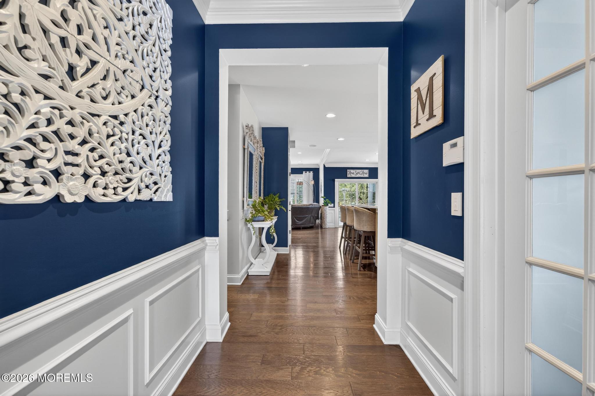 35 Addlestone Lane Manchester Township, NJ 08759 - Photo 6 of 44 a hallway with white cabinets and chandelier