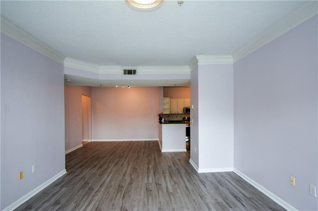 955 Juniper Street Northeast, Unit 4112 Atlanta, GA 30309 - Photo 11 of 27 a view of a room with wooden floor and a sink