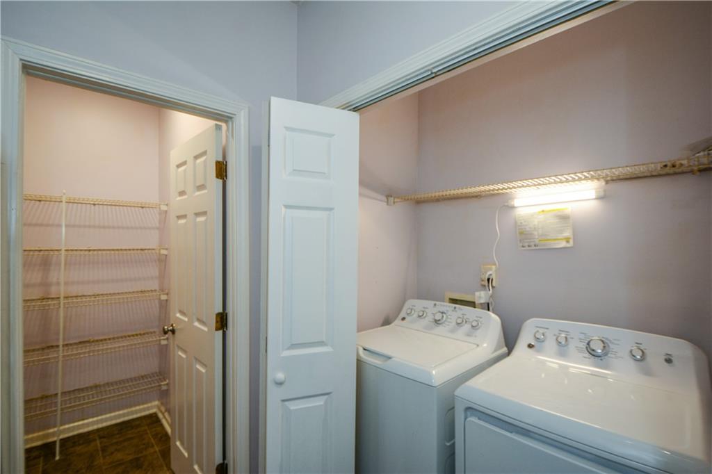 955 Juniper Street Northeast, Unit 4112 Atlanta, GA 30309 - Photo 15 of 27 a utility room with dryer and washer