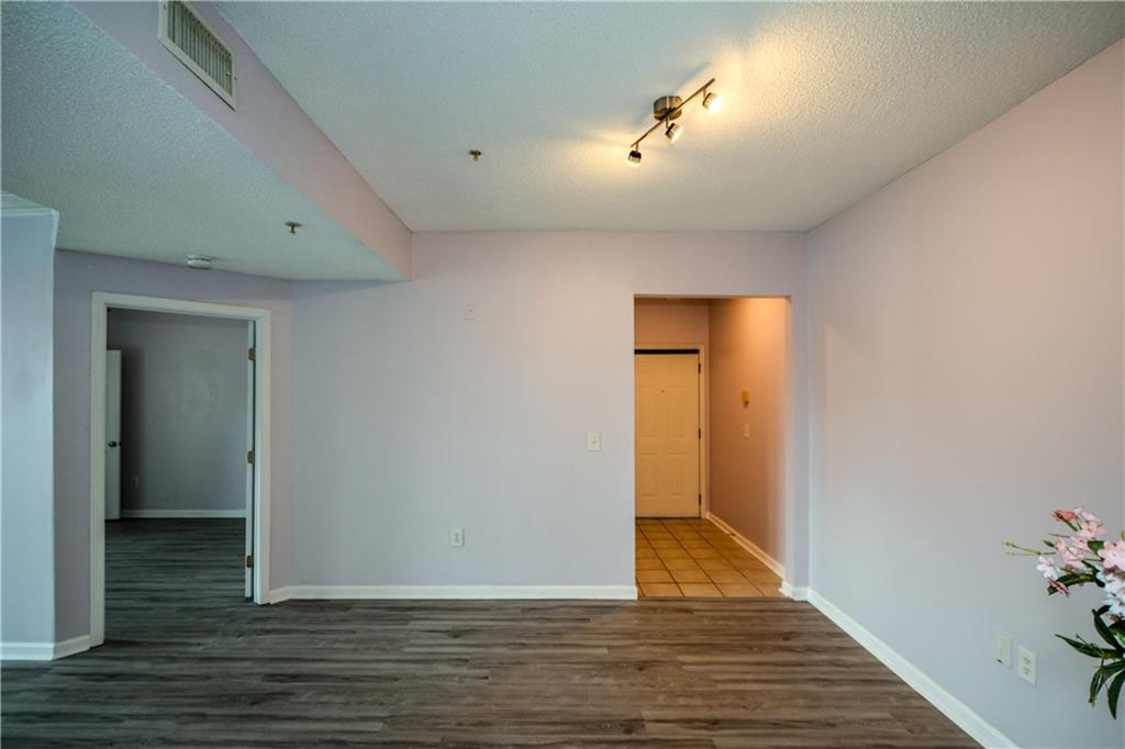 955 Juniper Street Northeast, Unit 4112 Atlanta, GA 30309 - Photo 19 of 27 a view of hallway with wooden floor